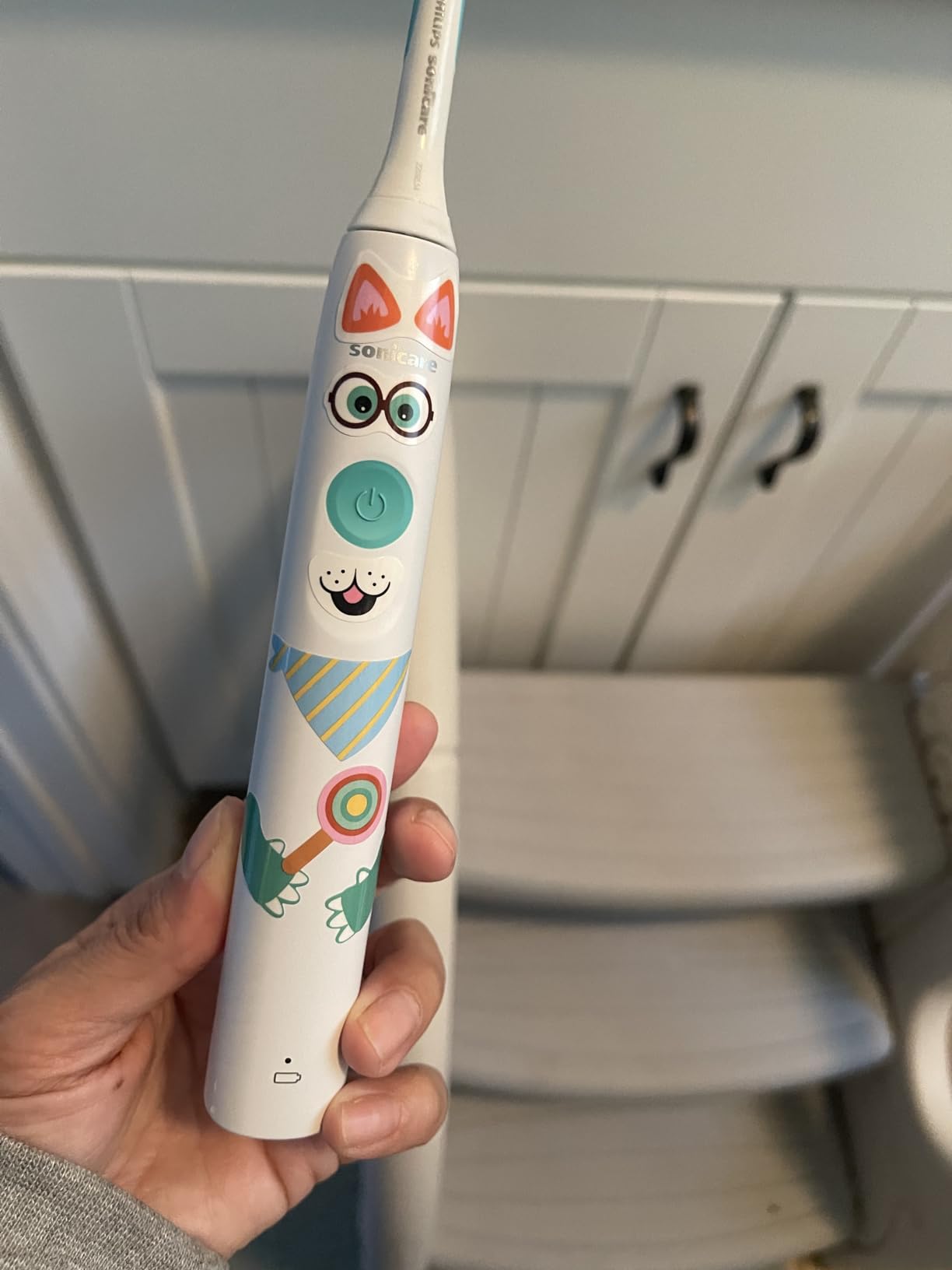 Philips Sonicare for Kids Electric Toothbrush, Design a Pet Edition, Gentle Clean, 2 Intensity Settings, KidPacer Timer, Includes Brush Head & Reusable Stickers, HX3601/01 customer photo 2