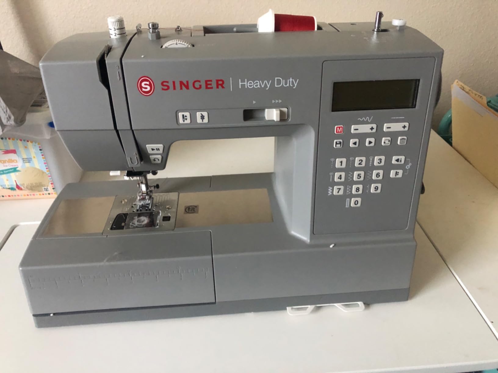 SINGER® 6700C Heavy Duty Computerized Machine with Accessory Kit | 411 stitch applications, lettering, touch button stitch selection, 1100 stitches/min,1-step buttonhole, LCD screen, LED light customer photo 2