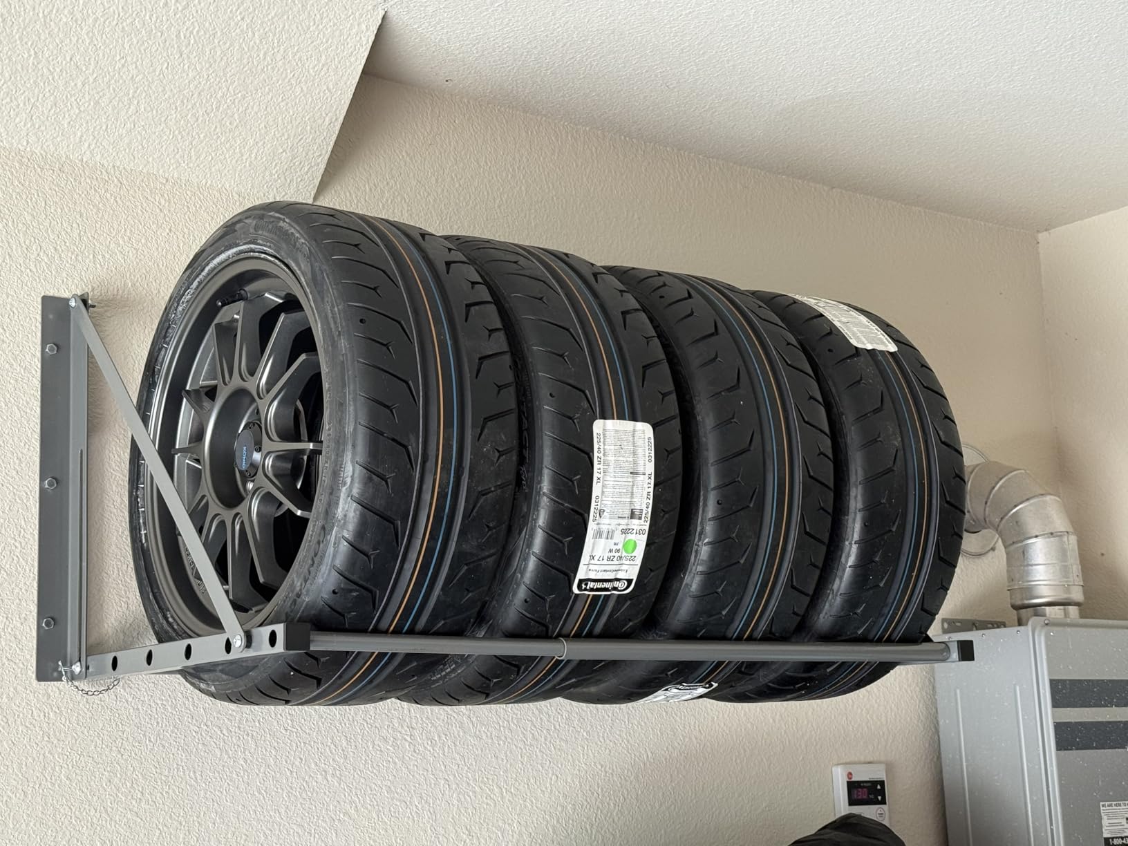 MaxxHaul Adjustable Wall Mount Folding Tire Rack – 32 to 48 Inch Width – 300 lb Capacity – Heavy Duty Steel Garage Tire Storage Holds 4 Tires – 70489 customer photo 2